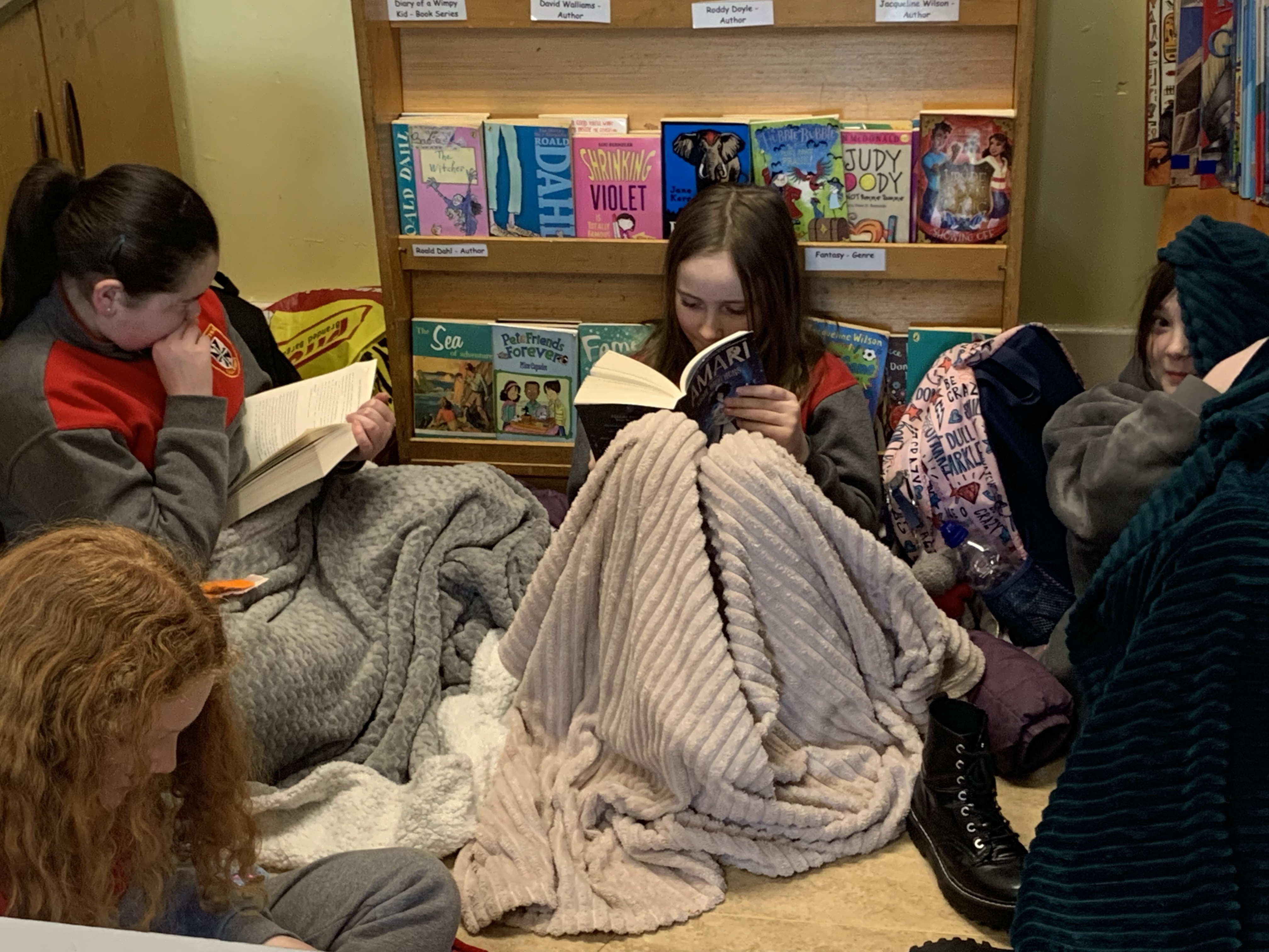 These girls are having fun in the reading room